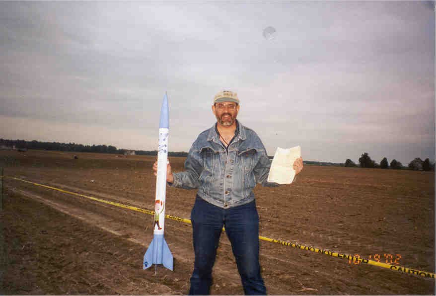 Mike holding Periwinkle's Pride & L1 Cert Papers